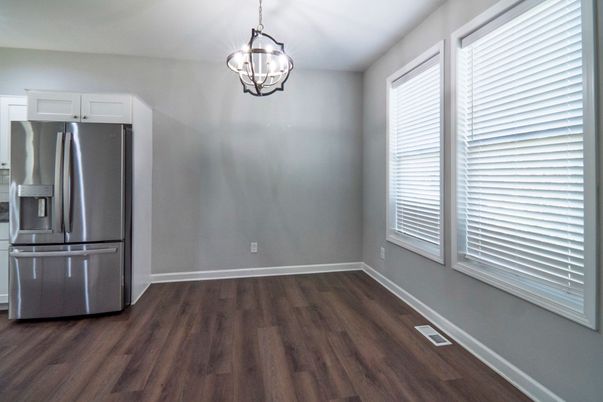 Empty room, Interior, Kitchen, Pendant Lights, Stainless Steel Appliances, Wood Texture Flooring