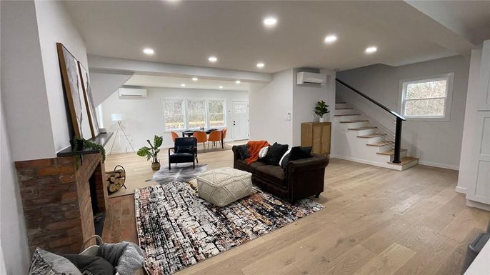 Dining room, Fireplace, Interior, Living room, Recessed Lighting, Wood Texture Flooring