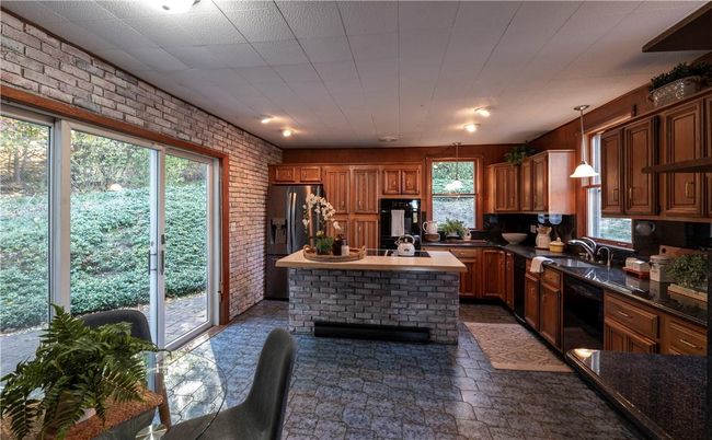 Interior, Kitchen, Pendant Lights, Recessed Lighting, Stainless Steel Appliances, Stone Walls
