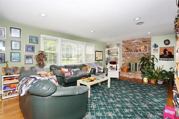 Fireplace, Interior, Living room, Recessed Lighting, Stone Walls, Wood Texture Flooring