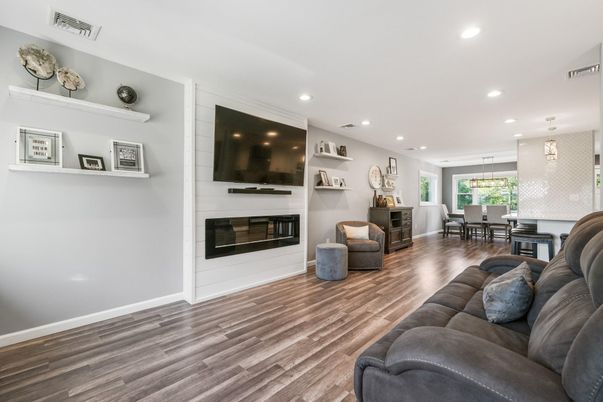 Dining room, Fireplace, Interior, Living room, Pendant Lights, Recessed Lighting, Wood Texture Flooring