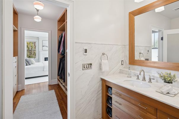 Bathroom, Dual Sink Vanities, Interior, Marble Walls, Wood Texture Flooring