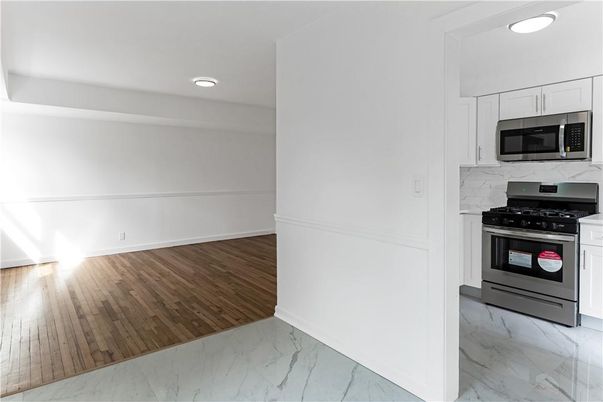 Interior, Kitchen, Marble, Recessed Lighting, Stainless Steel Appliances, Wood Texture Flooring