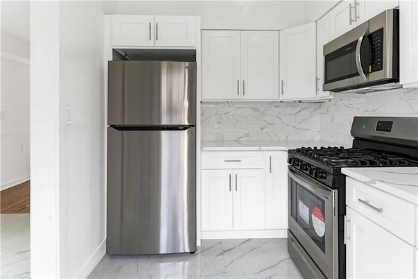 Interior, Kitchen, Marble, Marble Walls, Stainless Steel Appliances