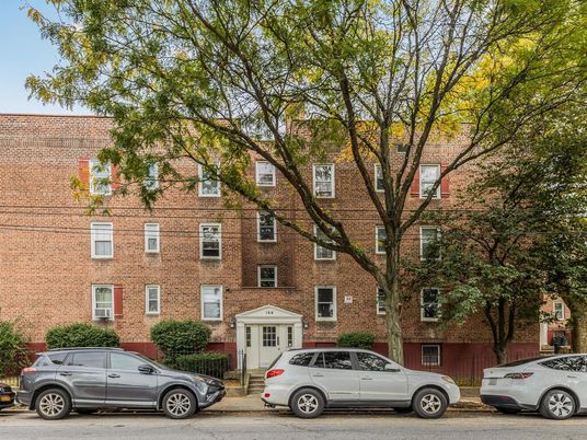 Exterior, Facade, Brick Facade, Condo Building