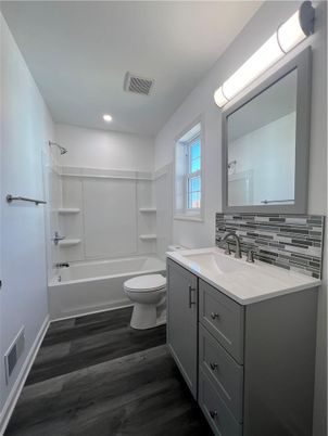 Bathroom, Dual Sink Vanities, Interior, Recessed Lighting, Wood Texture Flooring