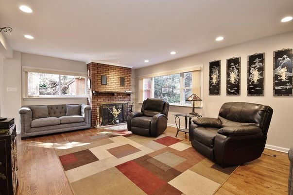 Fireplace, Interior, Living room, Recessed Lighting, Stone Walls, Wood Texture Flooring