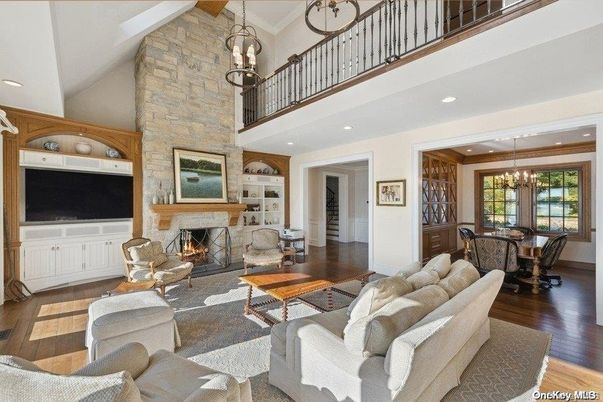 Chandelier, Dining room, Fireplace, Interior, Living room, Pendant Lights, Recessed Lighting, Stone Walls, Wood Texture Flooring
