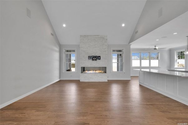Empty room, Fireplace, Interior, Pendant Lights, Recessed Lighting, Stone Walls, Wood Texture Flooring