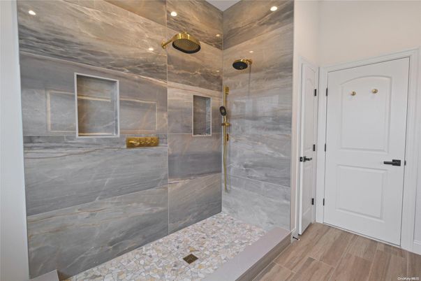 Bathroom, Glass Shower, Interior, Marble Walls, Recessed Lighting, Wood Texture Flooring