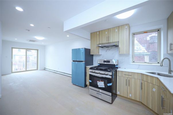 Interior, Kitchen, Marble Walls, Recessed Lighting, Stainless Steel Appliances