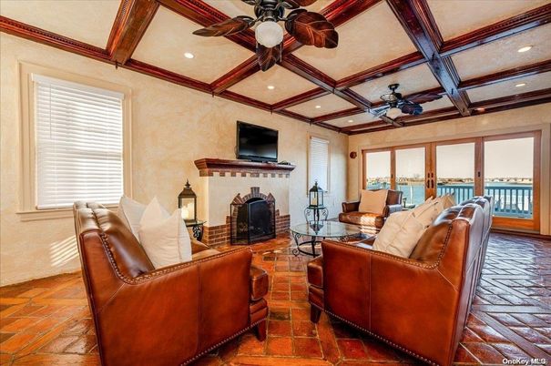 Fireplace, Interior, Living room, Recessed Lighting, Water, Wooden Beams