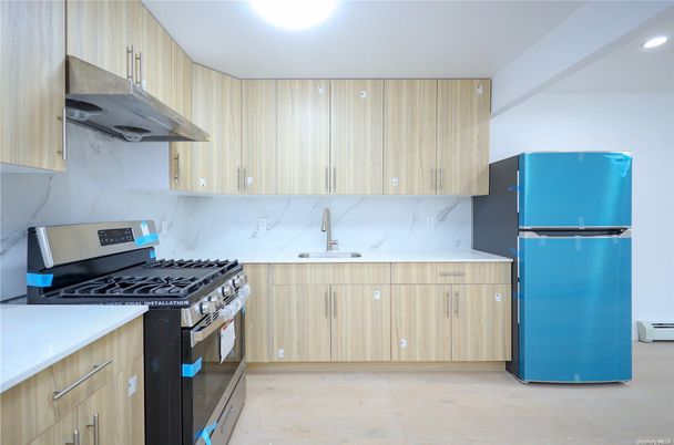 Interior, Kitchen, Marble Walls, Recessed Lighting, Stainless Steel Appliances