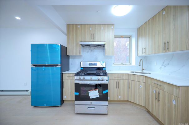 Interior, Kitchen, Marble Walls, Recessed Lighting, Stainless Steel Appliances