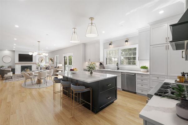 Dining room, Fireplace, Interior, Kitchen, Living room, Pendant Lights, Recessed Lighting, Stainless Steel Appliances, Wood Texture Flooring