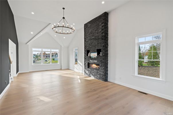 Chandelier, Empty room, Fireplace, Interior, Pendant Lights, Recessed Lighting, Wood Texture Flooring