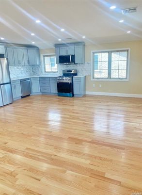 Interior, Kitchen, Marble Walls, Recessed Lighting, Stainless Steel Appliances, Wood Texture Flooring