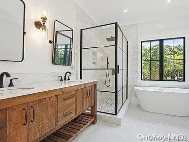 Bathroom, Dual Sink Vanities, Free Standing Baths, Glass Shower, Interior, Marble, Marble Walls, Recessed Lighting