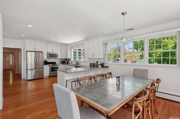 Dining room, Interior, Kitchen, Pendant Lights, Recessed Lighting, Stainless Steel Appliances, Wood Texture Flooring