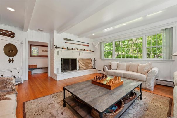 Fireplace, Interior, Living room, Recessed Lighting, Stone Walls, Wood Texture Flooring