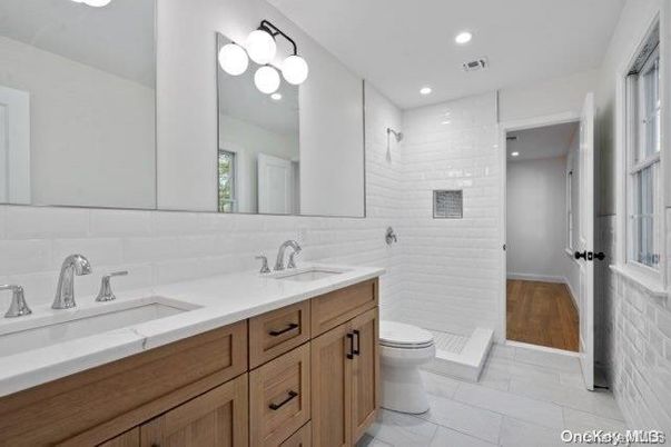 Bathroom, Dual Sink Vanities, Interior, Recessed Lighting, Wood Texture Flooring