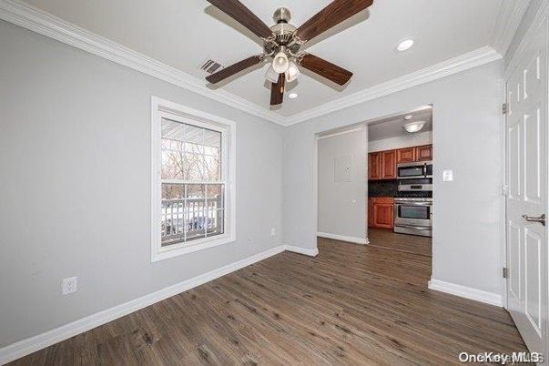 Empty room, Interior, Kitchen, Recessed Lighting, Stainless Steel Appliances, Wood Texture Flooring