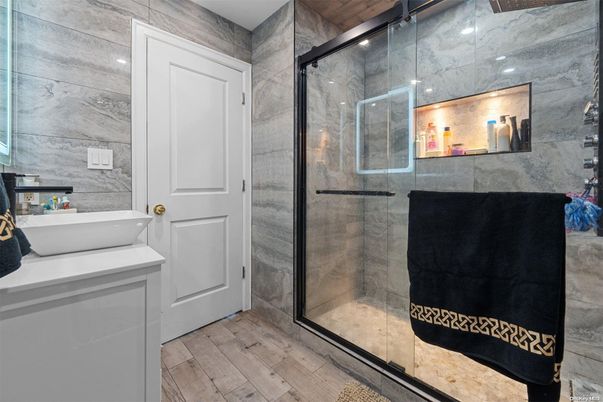 Bathroom, Glass Shower, Interior, Marble Walls, Recessed Lighting, Wood Texture Flooring