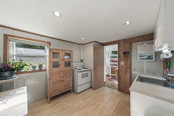 Interior, Kitchen, Recessed Lighting, Washer, Wood Texture Flooring