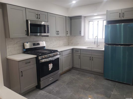 Interior, Kitchen, Marble Walls, Recessed Lighting, Stainless Steel Appliances