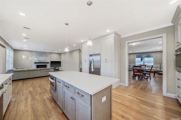 Dining room, Fireplace, Interior, Kitchen, Living room, Pendant Lights, Recessed Lighting, Stainless Steel Appliances, Wood Texture Flooring