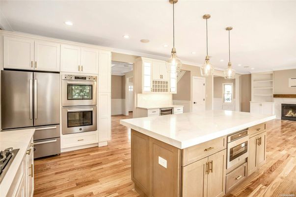 Fireplace, Interior, Kitchen, Pendant Lights, Recessed Lighting, Stainless Steel Appliances, Wood Texture Flooring