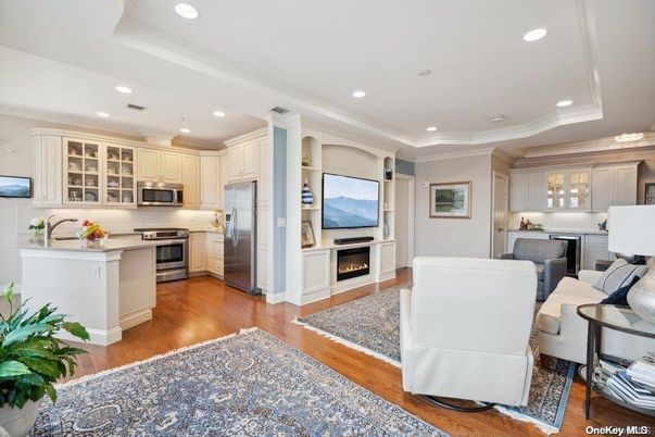 Fireplace, Interior, Kitchen, Recessed Lighting, Stainless Steel Appliances, Wood Texture Flooring