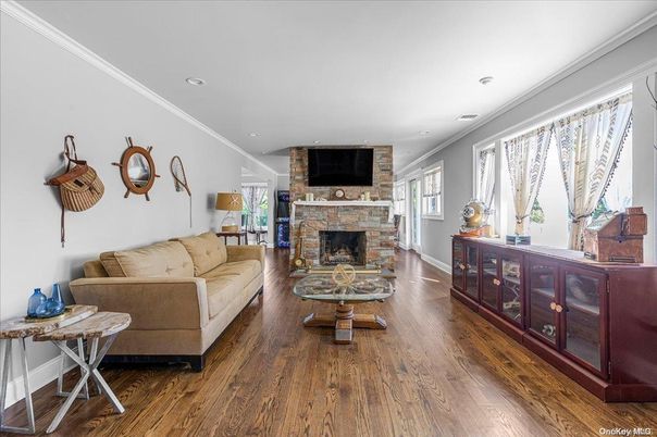 Fireplace, Interior, Living room, Recessed Lighting, Stone Walls, Wood Texture Flooring