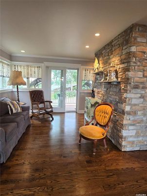 Fireplace, Interior, Living room, Recessed Lighting, Stone Walls, Wood Texture Flooring