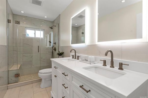 Bathroom, Dual Sink Vanities, Glass Shower, Interior, Marble Walls, Recessed Lighting