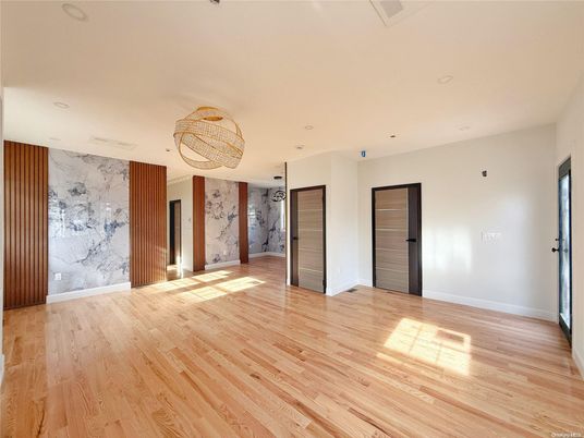 Chandelier, Empty room, Interior, Marble Walls, Recessed Lighting, Wood Texture Flooring