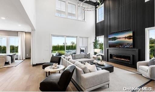 Chandelier, Dining room, Fireplace, Interior, Living room, Recessed Lighting, Wood Texture Flooring
