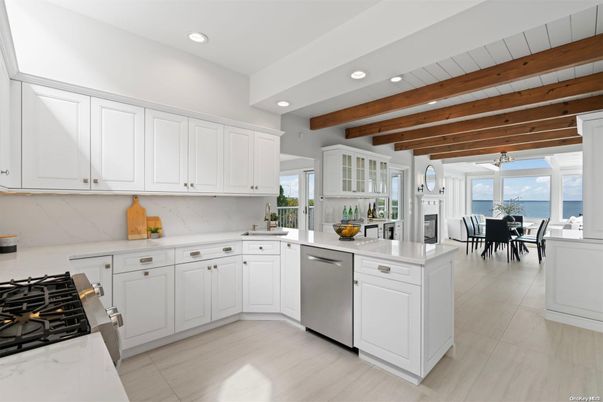 Dining room, Fireplace, Interior, Kitchen, Recessed Lighting, Stainless Steel Appliances, Water, Wooden Beams