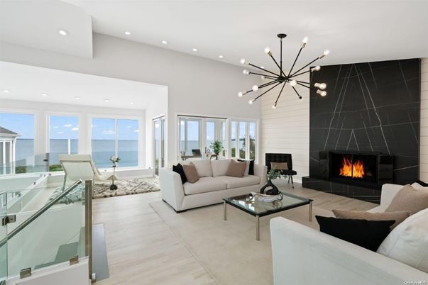 Fireplace, Interior, Living room, Pendant Lights, Recessed Lighting, Water, Wood Texture Flooring