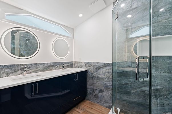 Bathroom, Dual Sink Vanities, Glass Shower, Interior, Recessed Lighting, Wood Texture Flooring