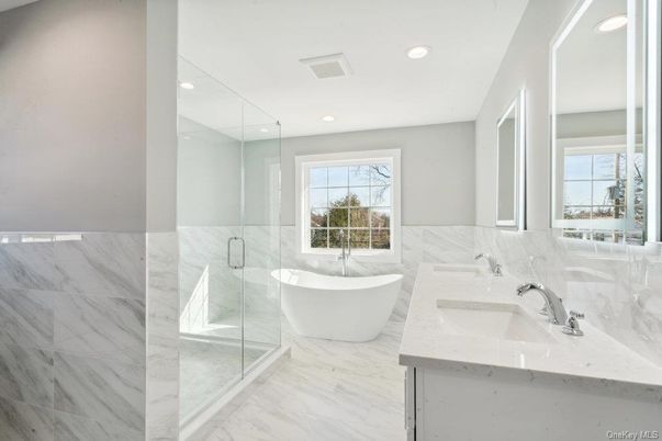 Bathroom, Dual Sink Vanities, Free Standing Baths, Glass Shower, Interior, Marble, Marble Walls, Recessed Lighting
