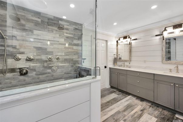 Bathroom, Dual Sink Vanities, Glass Shower, Interior, Recessed Lighting, Wood Texture Flooring