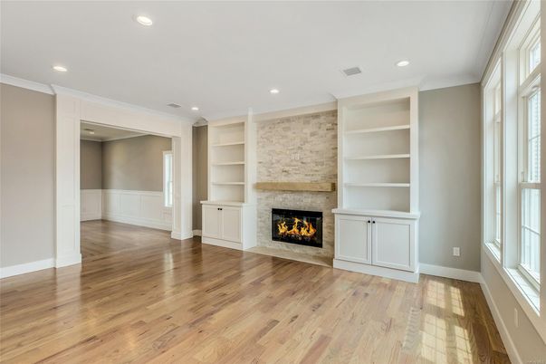 Empty room, Fireplace, Interior, Recessed Lighting, Stone Walls, Wood Texture Flooring