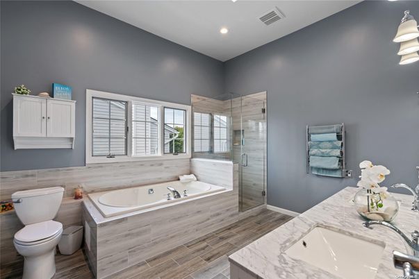 Bathroom, Dual Sink Vanities, Glass Shower, Interior, Recessed Lighting, Wood Texture Flooring