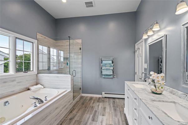 Bathroom, Dual Sink Vanities, Glass Shower, Interior, Recessed Lighting, Wood Texture Flooring