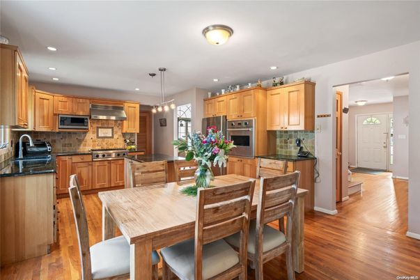 Dining room, Interior, Kitchen, Pendant Lights, Recessed Lighting, Stainless Steel Appliances, Wood Texture Flooring