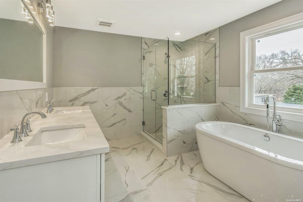 Bathroom, Dual Sink Vanities, Free Standing Baths, Glass Shower, Interior, Marble, Marble Walls, Recessed Lighting