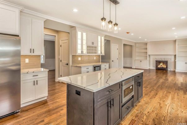 Fireplace, Interior, Kitchen, Pendant Lights, Recessed Lighting, Stainless Steel Appliances, Wood Texture Flooring
