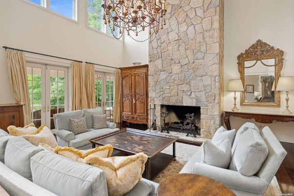Chandelier, Fireplace, Interior, Living room, Stone Walls, Wood Texture Flooring