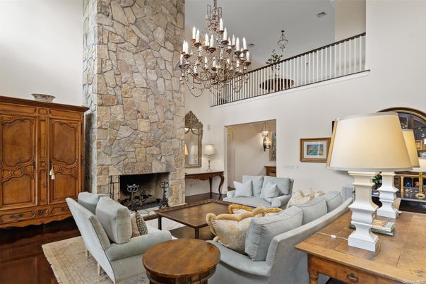 Chandelier, Fireplace, Interior, Living room, Stone Walls, Wood Texture Flooring